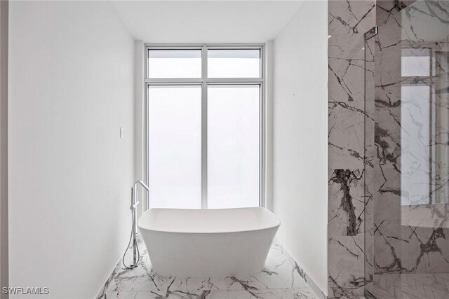 1165 8th St S Unit 202, Naples, FL 34102 - full bathroom with marble finish floor, expansive windows, a soaking tub, and a marble finish shower