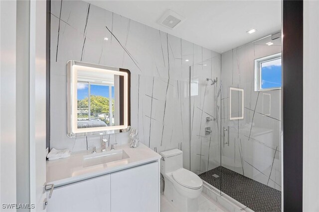 1165 8th St S Unit 202, Naples, FL 34102 - full bathroom with visible vents, toilet, vanity, and a marble finish shower