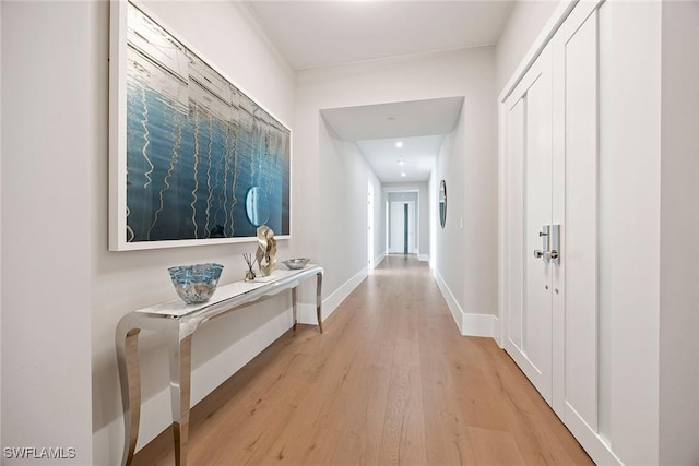 1165 8th St S Unit 202, Naples, FL 34102 - hallway with baseboards and light wood-type flooring