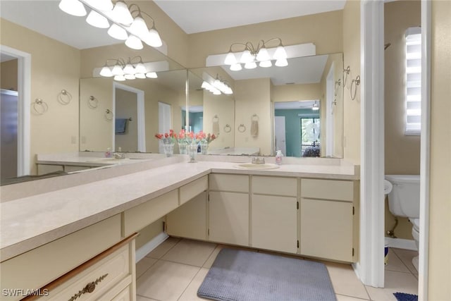 4764 Pembrooke Ln, Bonita Springs, FL 34134 - bathroom featuring toilet, tile patterned flooring, and vanity