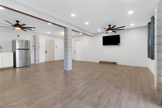 4764 Pembrooke Ln, Bonita Springs, FL 34134 - unfurnished living room with ornate columns, wood finished floors, recessed lighting, and a ceiling fan
