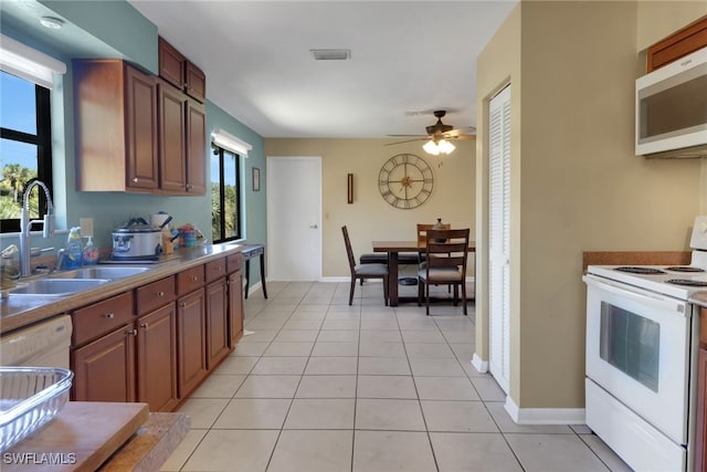 4764 Pembrooke Ln, Bonita Springs, FL 34134 - kitchen featuring visible vents, white appliances, a ceiling fan, a sink, and light tile patterned floors