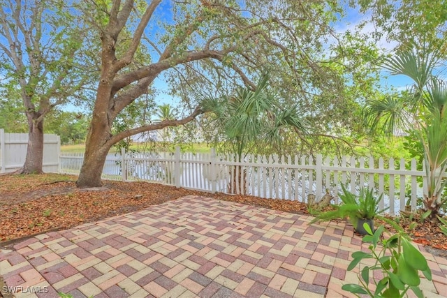 view of patio featuring fence