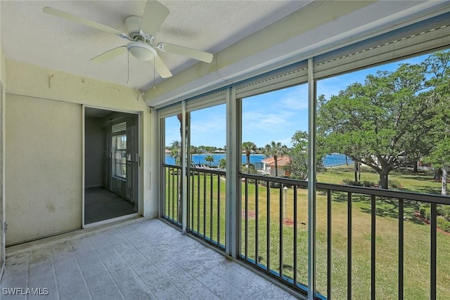 529 Mardel Dr Unit 311, Naples, FL 34104 - unfurnished sunroom featuring a water view and a ceiling fan