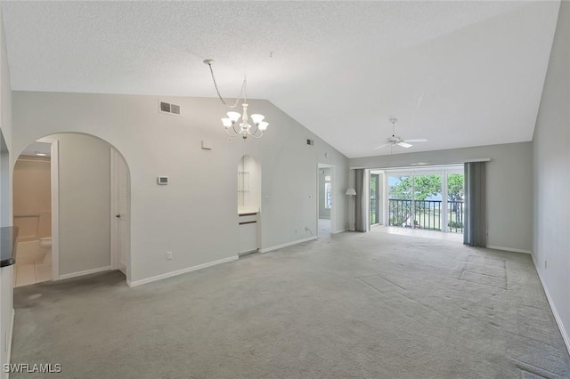529 Mardel Dr Unit 311, Naples, FL 34104 - unfurnished living room featuring a ceiling fan, light carpet, baseboards, arched walkways, and a chandelier