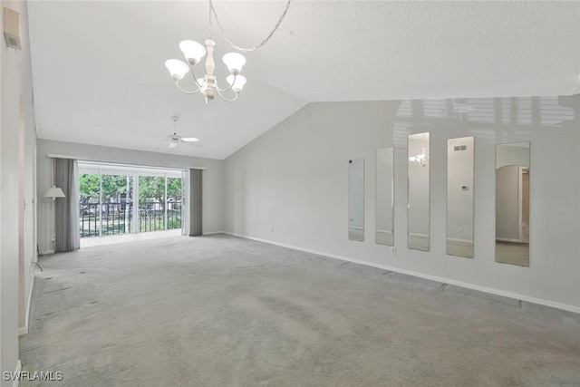 529 Mardel Dr Unit 311, Naples, FL 34104 - unfurnished living room with a chandelier, vaulted ceiling, carpet floors, and baseboards