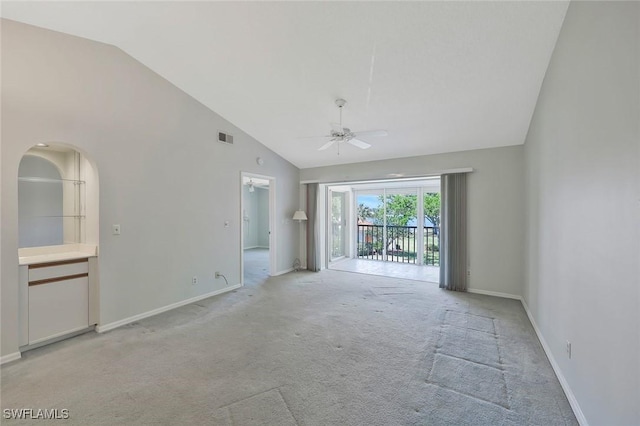 529 Mardel Dr Unit 311, Naples, FL 34104 - unfurnished room featuring ceiling fan, light carpet, baseboards, and high vaulted ceiling