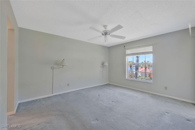529 Mardel Dr Unit 311, Naples, FL 34104 - carpeted empty room featuring a textured ceiling, a ceiling fan, and baseboards