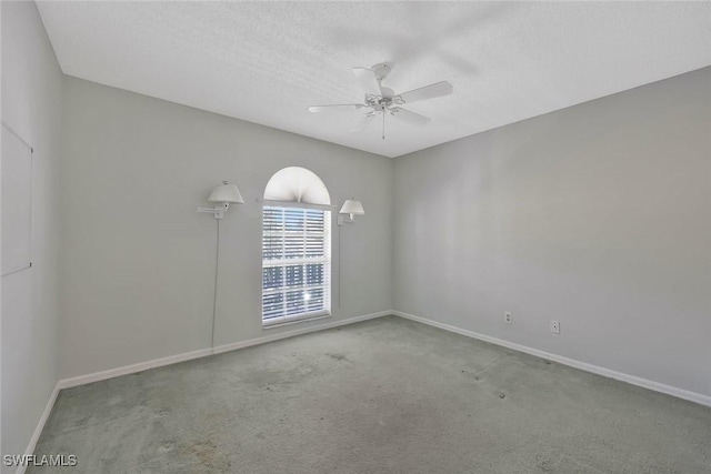529 Mardel Dr Unit 311, Naples, FL 34104 - spare room with a ceiling fan, baseboards, carpet, and a textured ceiling