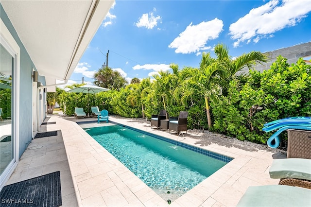 pool with a patio
