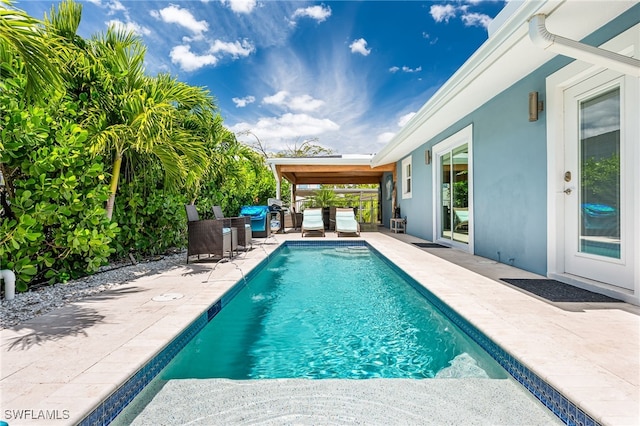 outdoor pool featuring a patio