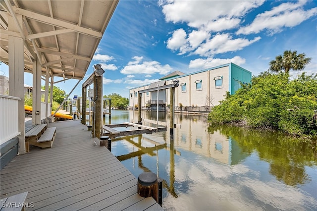 view of dock featuring a water view and boat lift