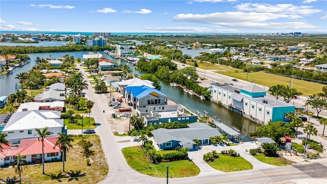 birds eye view of property featuring a residential view and a water view