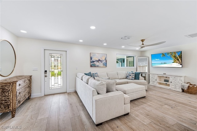living room with a ceiling fan, recessed lighting, light wood-style floors, and visible vents