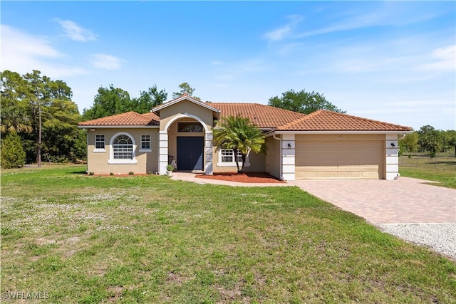 3641 4th Ave SE, Naples, FL 34117 - mediterranean / spanish-style house featuring stucco siding, decorative driveway, an attached garage, a front yard, and a tiled roof
