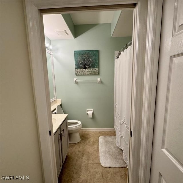 full bath featuring vanity, baseboards, visible vents, tile patterned floors, and toilet