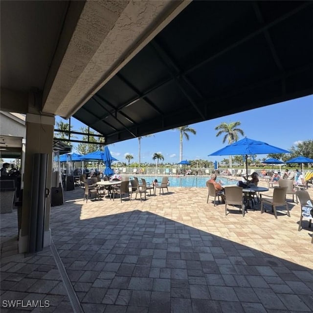 view of patio featuring a community pool