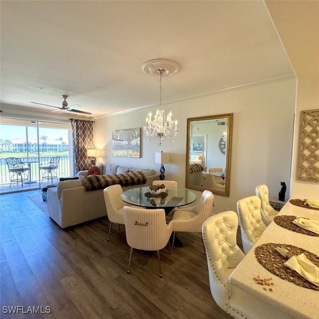 dining space featuring dark wood-style floors, ceiling fan with notable chandelier, and crown molding