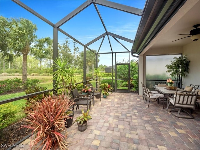 20240 Black Tree Ln, Estero, FL 33928 - sunroom with outdoor dining space and a ceiling fan