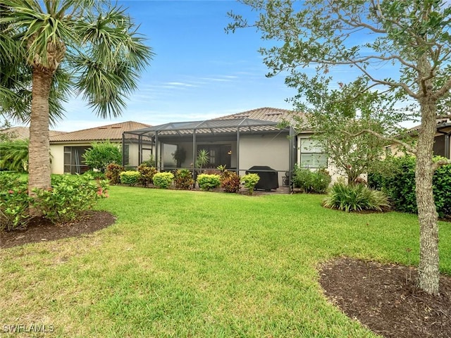 20240 Black Tree Ln, Estero, FL 33928 - exterior space featuring a tile roof, stucco siding, a lawn, and glass enclosure