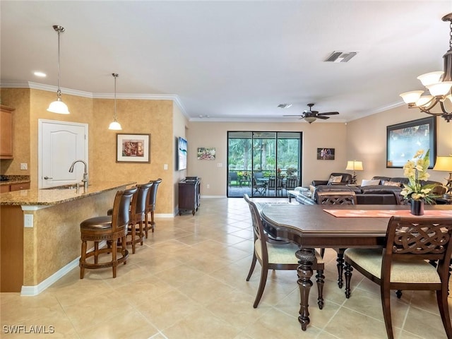 20240 Black Tree Ln, Estero, FL 33928 - dining room featuring visible vents, ceiling fan with notable chandelier, baseboards, and ornamental molding