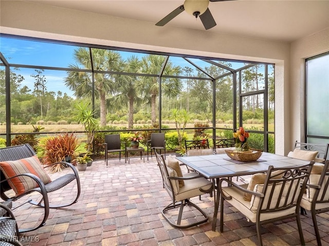 20240 Black Tree Ln, Estero, FL 33928 - sunroom featuring brick floor, outdoor dining area, and ceiling fan