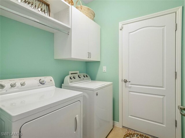 20240 Black Tree Ln, Estero, FL 33928 - laundry room with washer and dryer, cabinet space, and light tile patterned floors