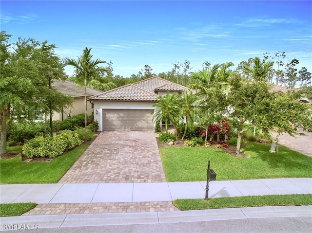 20240 Black Tree Ln, Estero, FL 33928 - view of front of house featuring stucco siding, a front lawn, decorative driveway, a garage, and a tiled roof
