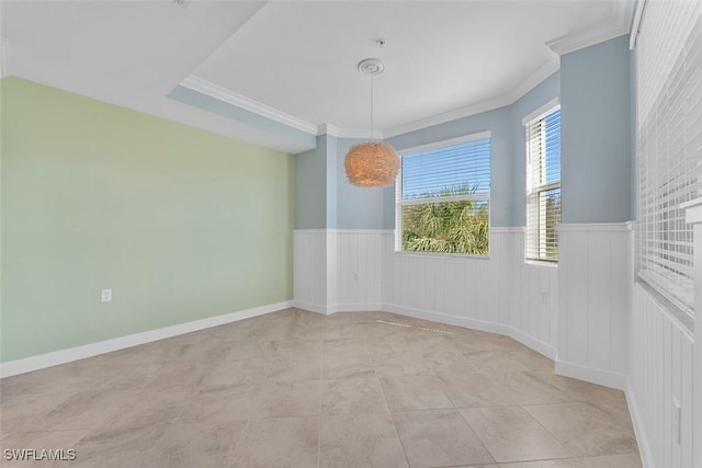 6058 National Blvd Unit 327, Ave Maria, FL 34142 - unfurnished room with crown molding, light tile patterned flooring, and wainscoting