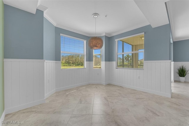 6058 National Blvd Unit 327, Ave Maria, FL 34142 - spare room featuring tile patterned flooring, wainscoting, and a healthy amount of sunlight