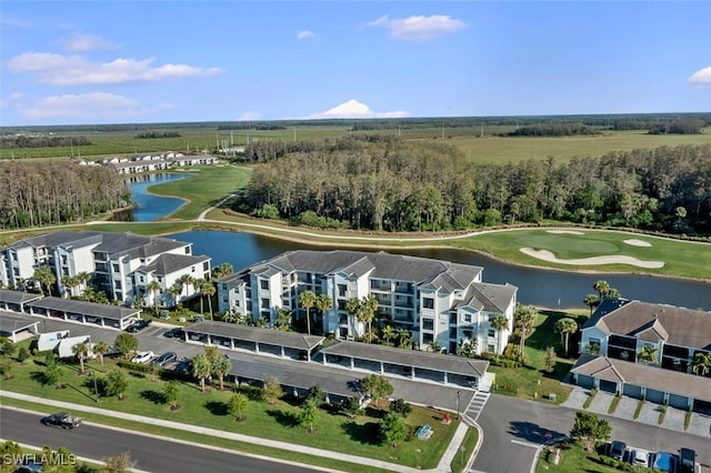 6058 National Blvd Unit 327, Ave Maria, FL 34142 - drone / aerial view with view of golf course and a water view