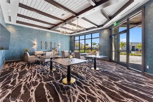 6058 National Blvd Unit 327, Ave Maria, FL 34142 - interior space with beamed ceiling, plenty of natural light, coffered ceiling, and an inviting chandelier