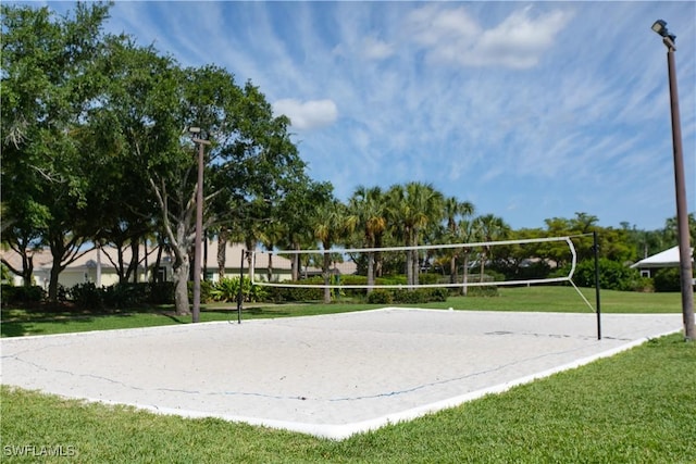 2604 Stonyhill Ct, Cape Coral, FL 33991 - surrounding community featuring a yard and volleyball court