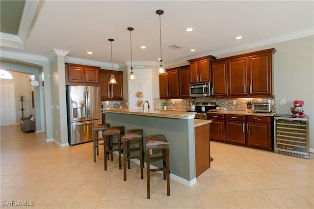 2604 Stonyhill Ct, Cape Coral, FL 33991 - kitchen with tasteful backsplash, a kitchen breakfast bar, light stone counters, stainless steel appliances, and beverage cooler