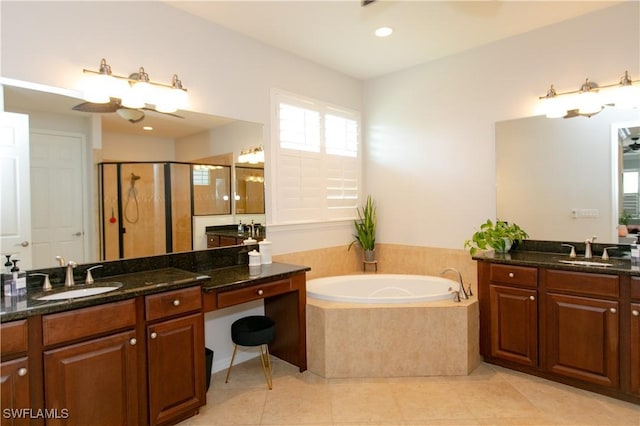 2604 Stonyhill Ct, Cape Coral, FL 33991 - full bath with a sink, tile patterned floors, two vanities, and a garden tub