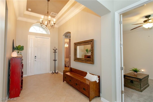 2604 Stonyhill Ct, Cape Coral, FL 33991 - entrance foyer featuring ornamental molding, arched walkways, visible vents, and ceiling fan with notable chandelier