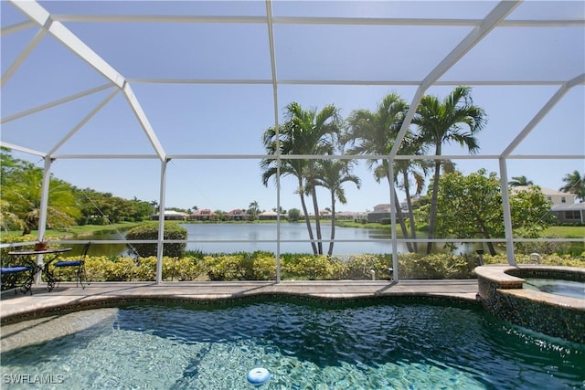 2604 Stonyhill Ct, Cape Coral, FL 33991 - view of pool featuring a water view, a patio, a pool with connected hot tub, and glass enclosure