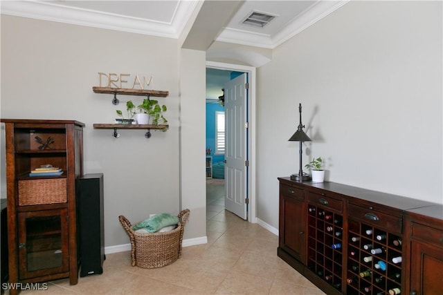 2604 Stonyhill Ct, Cape Coral, FL 33991 - hallway with crown molding, light tile patterned flooring, baseboards, and visible vents