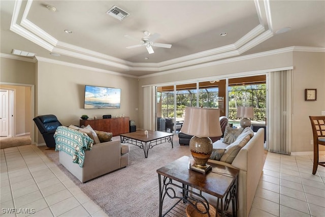 9846 Weather Stone Pl, Fort Myers, FL 33913 - living room with a tray ceiling, light tile patterned floors, ceiling fan, and crown molding