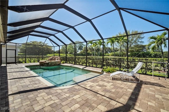 9846 Weather Stone Pl, Fort Myers, FL 33913 - view of swimming pool featuring a patio area, a pool with connected hot tub, and glass enclosure