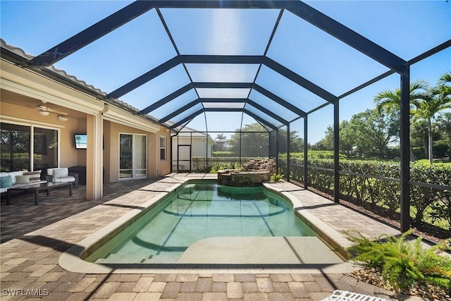 9846 Weather Stone Pl, Fort Myers, FL 33913 - view of pool with a patio area, a pool with connected hot tub, an outdoor living space, ceiling fan, and a lanai