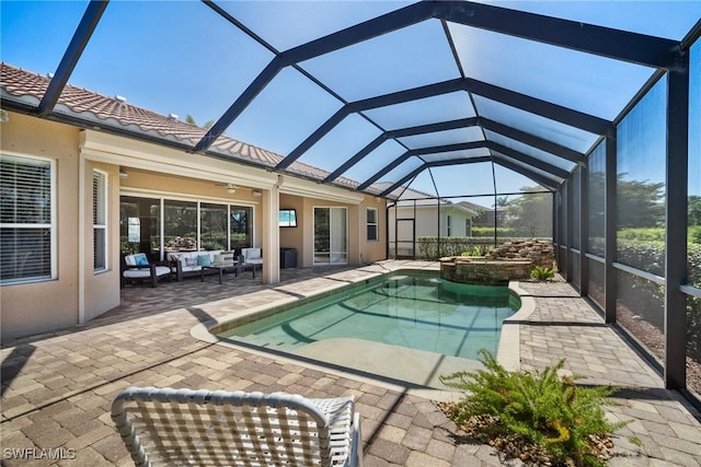 9846 Weather Stone Pl, Fort Myers, FL 33913 - view of pool featuring outdoor lounge area, a patio area, a pool with connected hot tub, a lanai, and a ceiling fan