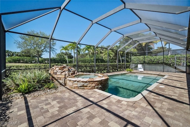 9846 Weather Stone Pl, Fort Myers, FL 33913 - view of pool with a patio area, a pool with connected hot tub, and glass enclosure
