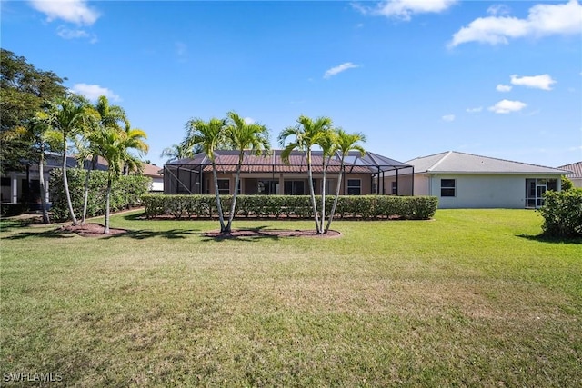 9846 Weather Stone Pl, Fort Myers, FL 33913 - back of property with a yard and glass enclosure