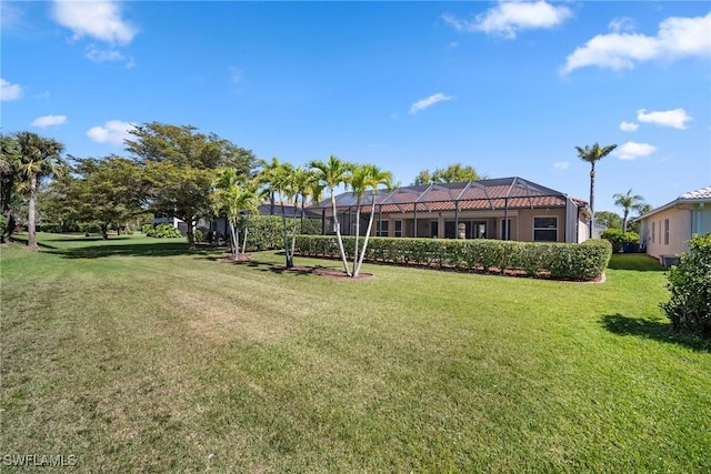 9846 Weather Stone Pl, Fort Myers, FL 33913 - view of grassy yard with glass enclosure