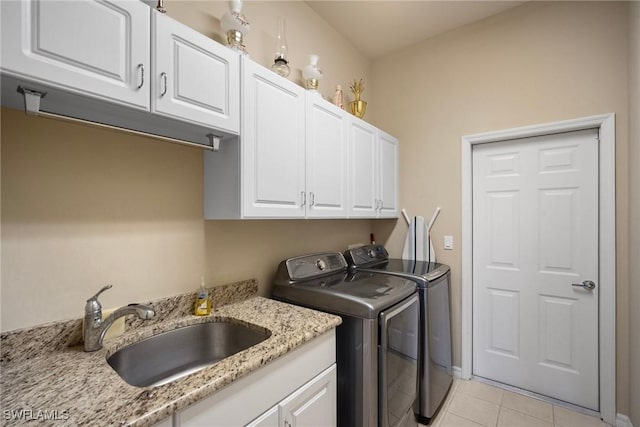 9846 Weather Stone Pl, Fort Myers, FL 33913 - laundry room with separate washer and dryer, cabinet space, and light tile patterned floors