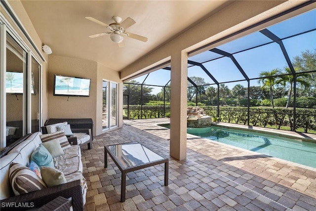 9846 Weather Stone Pl, Fort Myers, FL 33913 - view of patio featuring a ceiling fan, a pool with connected hot tub, outdoor lounge area, and glass enclosure