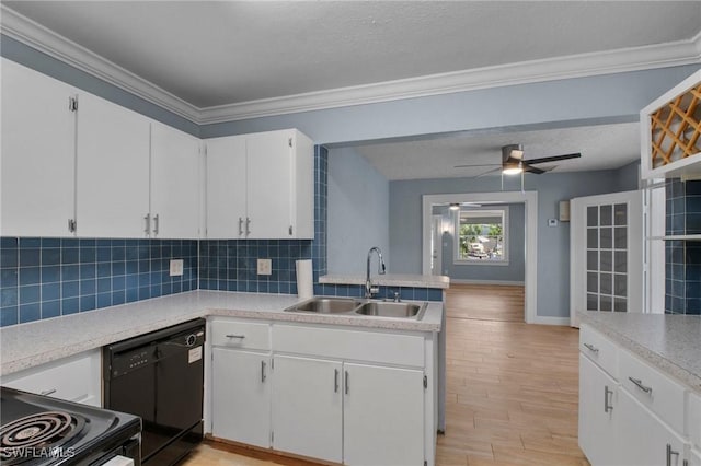 290 Granada Blvd, Fort Myers, FL 33905 - kitchen with light countertops, backsplash, a sink, white cabinets, and black appliances