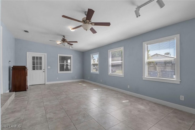290 Granada Blvd, Fort Myers, FL 33905 - empty room featuring rail lighting, light tile patterned floors, baseboards, visible vents, and ceiling fan