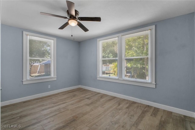 290 Granada Blvd, Fort Myers, FL 33905 - empty room featuring baseboards, wood finished floors, and a ceiling fan